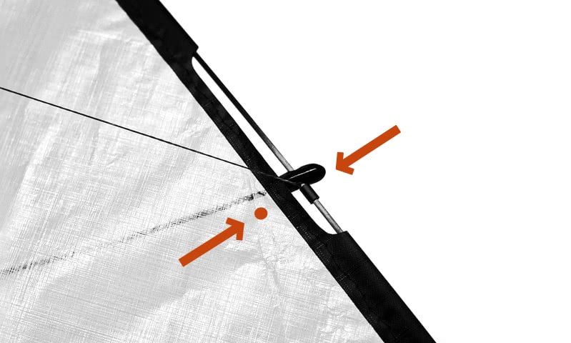 Kite assembly step 8: leading edge connector facing the mark on the sail.